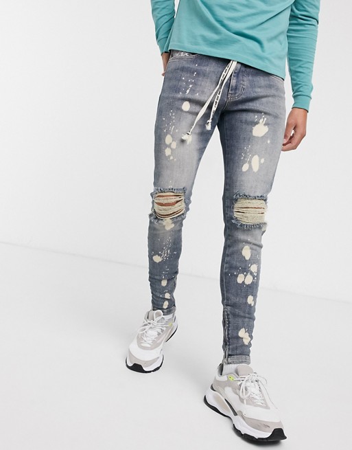 The Couture Club bleached jeans with knee rips in blue