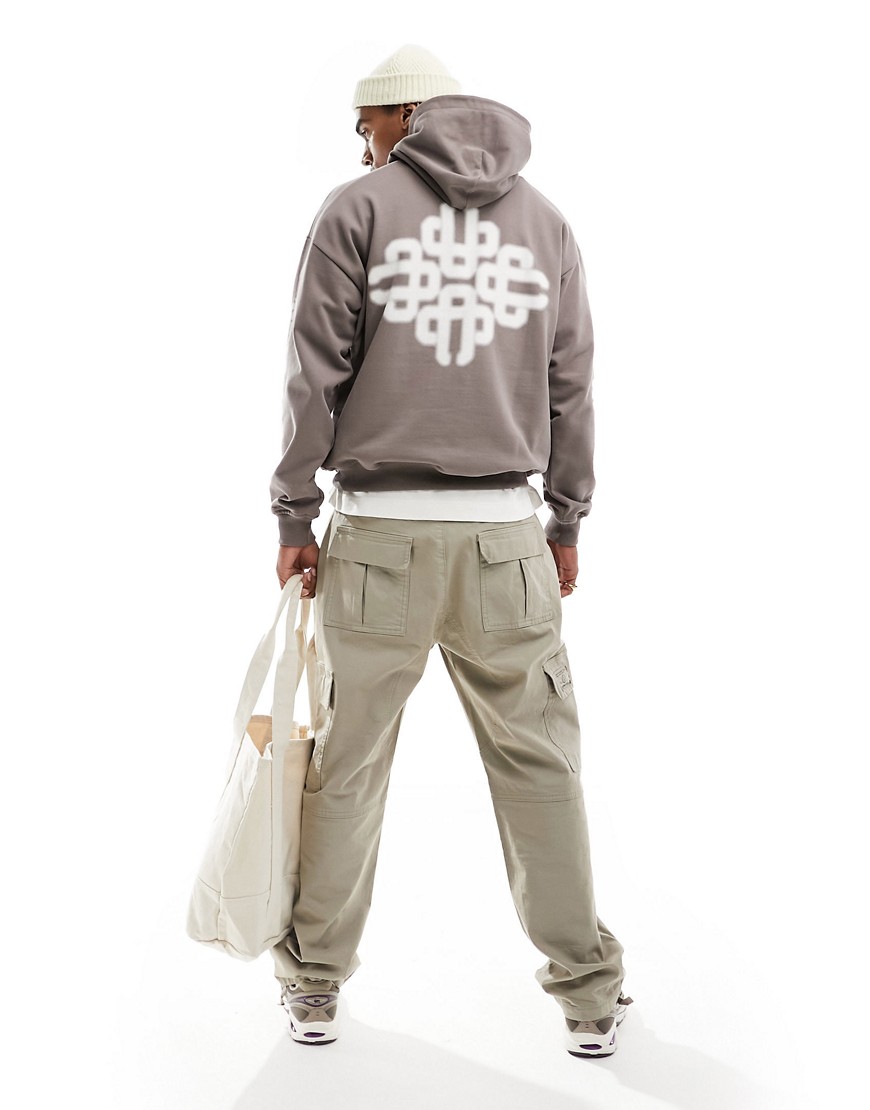 The Couture Club blurred emblem graphic hoodie in brown