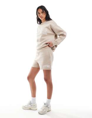 The Couture Club The Couture Club co-ord CTRE varsity shorts in beige-Neutral