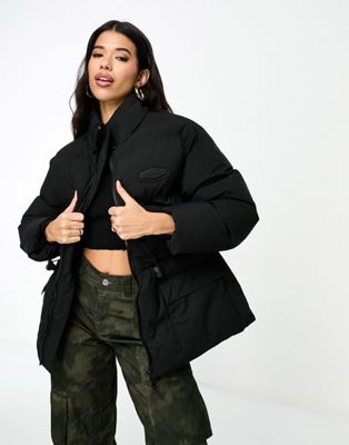 The Couture Club oversized pleated puffer jacket in black with tie waist detail  - ASOS Price Checker