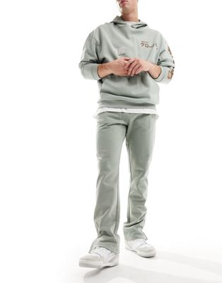 The Couture Club emblem trackies in khaki - ASOS Price Checker