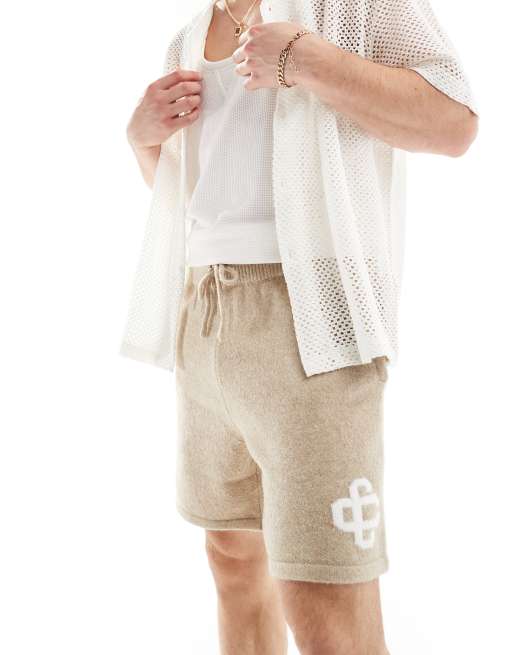The Couture Club emblem knit shorts in beige
