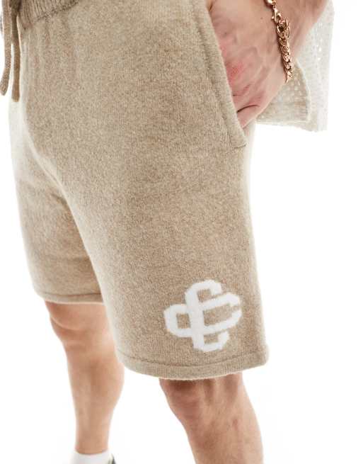 The Couture Club emblem knitted shorts in beige | ASOS