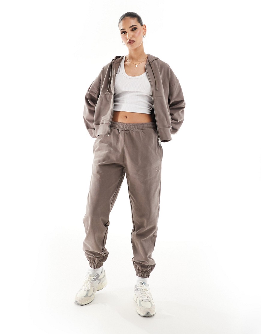 emblem relaxed sweatpants in brown - part of a set