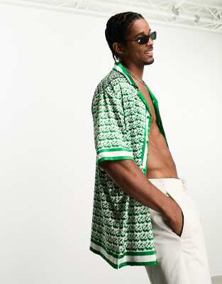 The Couture Club emblem short sleeve revere collared shirt in green with all over print - ASOS Price Checker