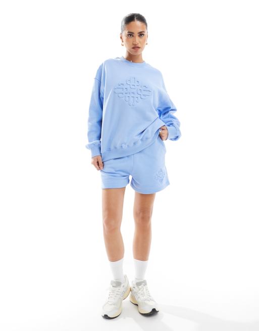 The Couture Club embossed shorts in light blue (part of a set)