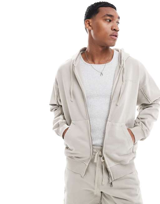 The Couture Club - Felpa con cappuccio beige con cuciture grezze e zip in coordinato