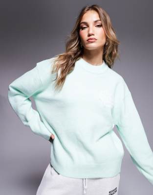 The Couture Club fluffy emblem knit in mint-Green