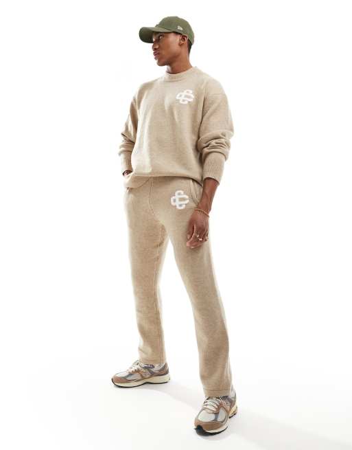The Couture Club fluffy emblem knitted pants in beige