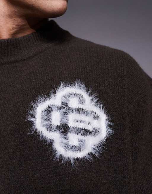 The Couture Club fluffy knit emblem sweater in brown - part of a
