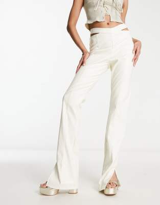 The Couture Club high waisted cut out pants in cream