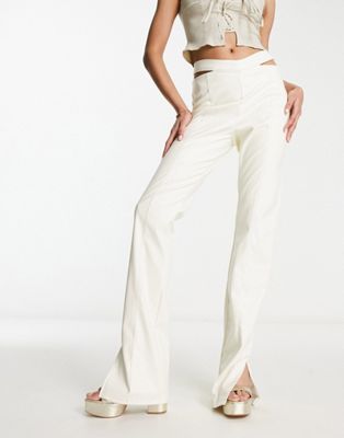The Couture Club high waisted cut out trousers in cream-White