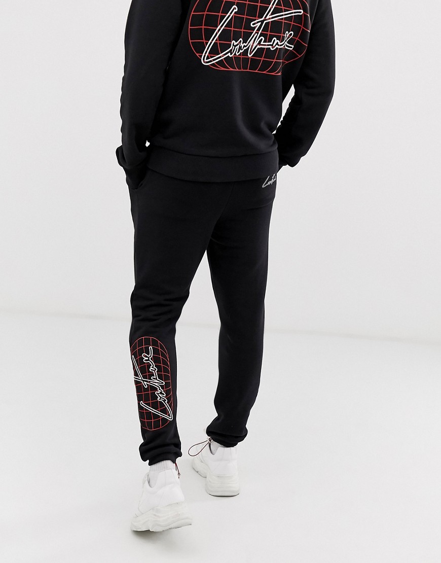The Couture Club loose joggers with globe print in black