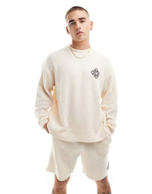 The Couture Club – Naturvit, stickad sweatshirt med rund halsringning och emblem, del av set