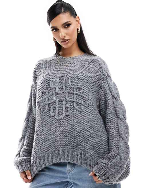 The Couture Club open stitch emblem jumper in grey