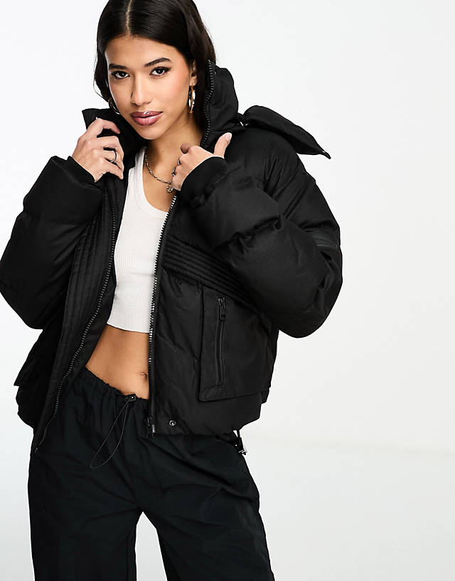 The Couture Club - oversized cropped puffer jacket in black with tie hem