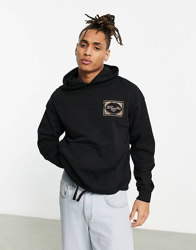 The Couture Club - oversized hoodie in black with stamp logo print and drawcord hem