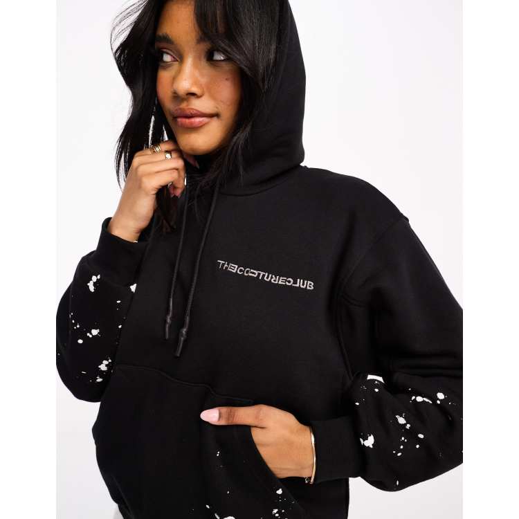 The Couture Club paint splatter hoodie in black ASOS