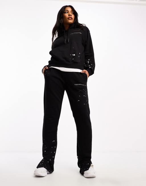 The Couture Club paint splatter straight leg sweatpants in black