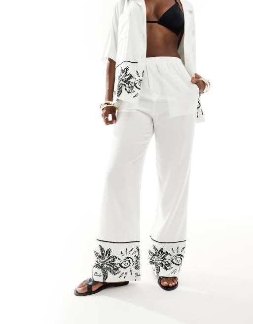 The Couture Club palm print embroidery wide leg pants in white - part of a set