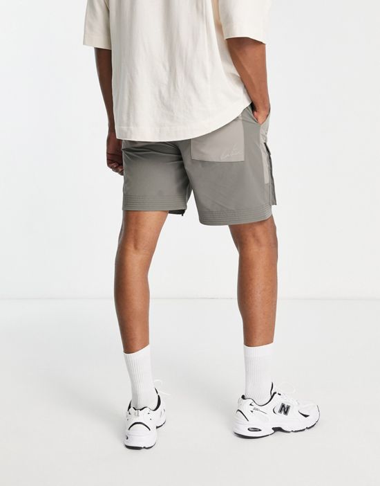 https://images.asos-media.com/products/the-couture-club-paneled-cargo-shorts-in-tonal-gray/202798989-2?$n_550w$&wid=550&fit=constrain
