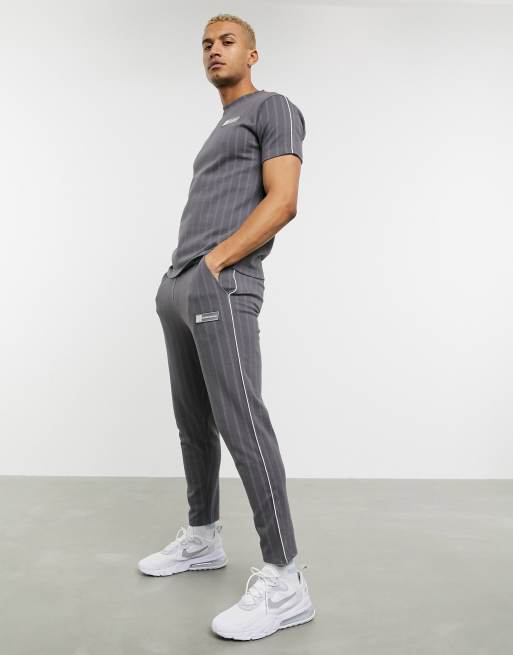 The Couture Club pin stripe smart tapered sweatpants in gray