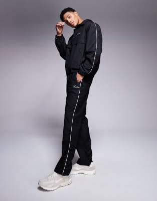 piped track pants in black - part of a set