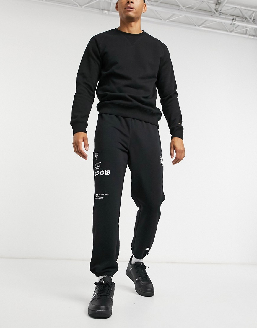 The Couture Club premium sweatpants with multi logo badge in black