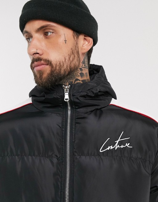 The Couture Club puffer jacket in black with taping