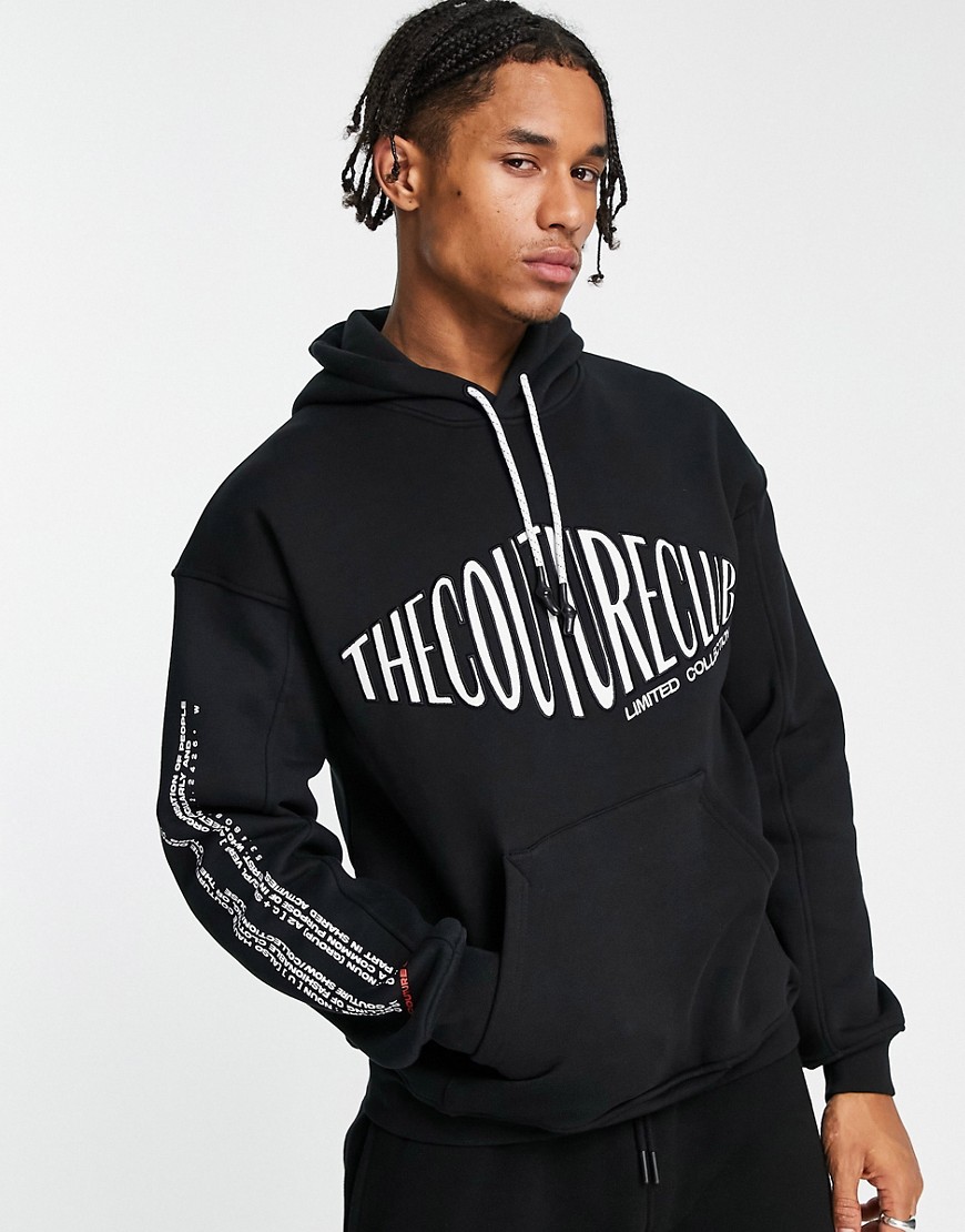 The Couture Club pullover hoodie in black with oversized logo print