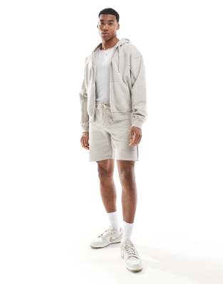 The Couture Club raw seam zip up hoodie in beige - part of a set