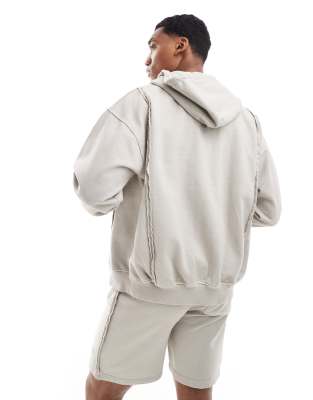 The Couture Club raw seam zip up hoodie in beige - part of a set