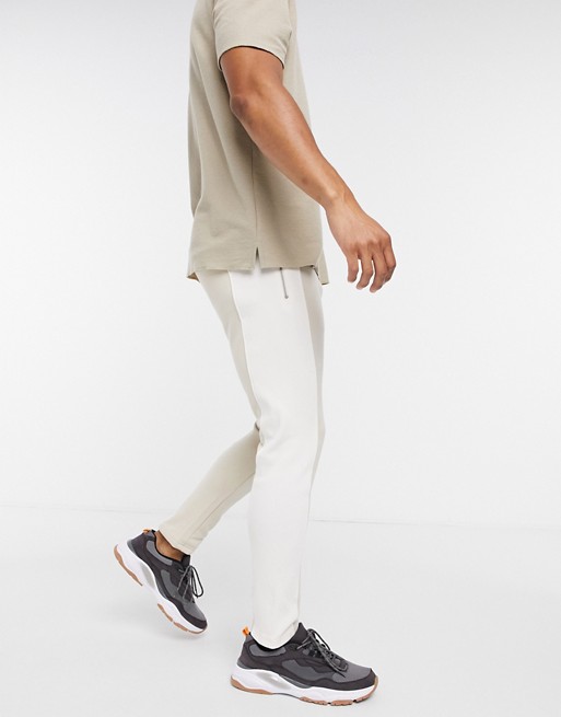 The Couture Club rib panelled tapered joggers in beige