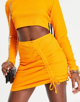 The Couture Club ribbed plait detail mini skirt co-ord in orange