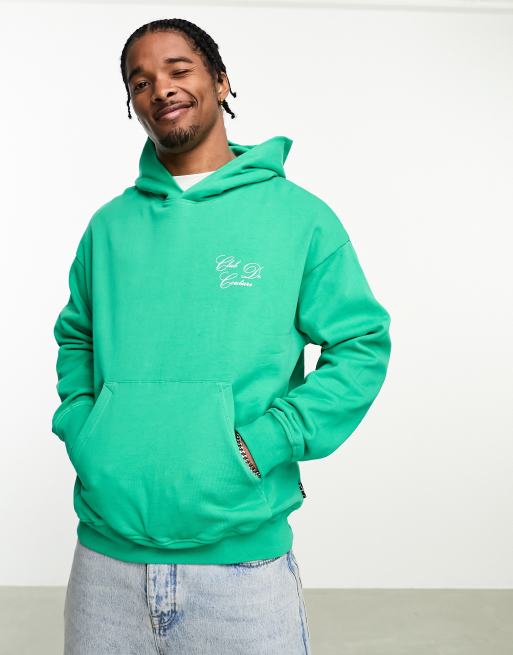 The Couture Club script pullover hoodie in green with chest and back print