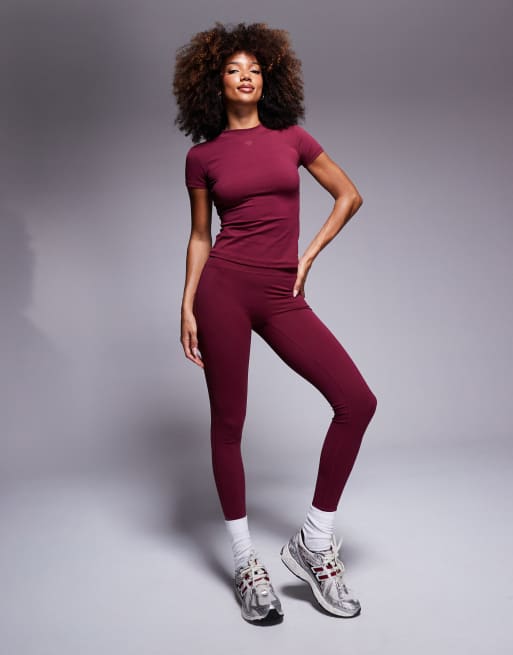 The Couture Club sculpting stretch emblem leggings in burgundy (part of a set)