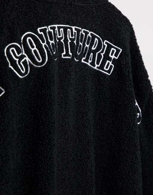 The Couture Club sherpa hoodie in black with gothic logo applique