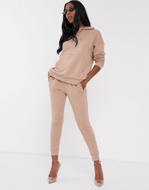 The Couture Club skinny motif jogger in tan
