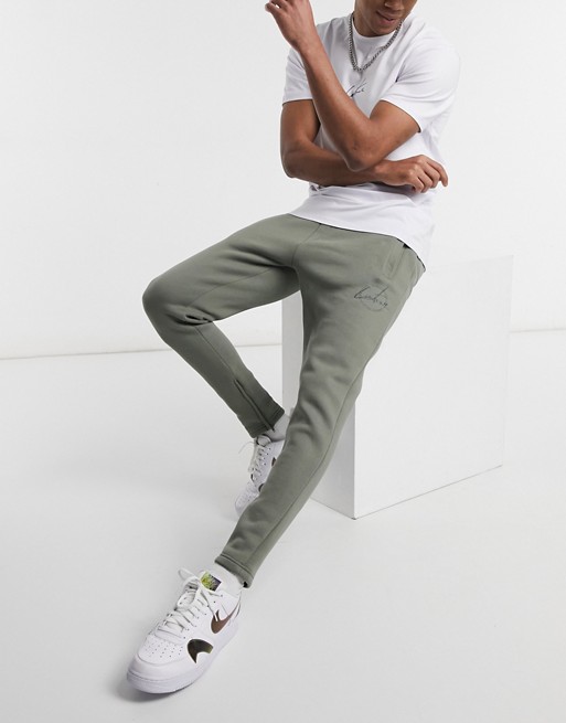 The Couture Club slim fit archive update embroidered joggers in green