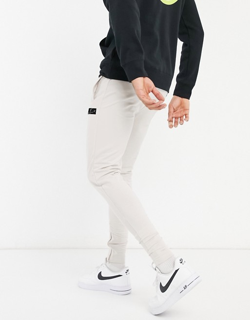 The Couture Club slim fit joggers with flock detail in grey