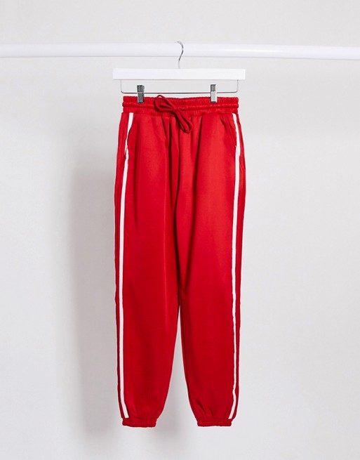 The Couture Club stripe side seam detail oversized joggers in red