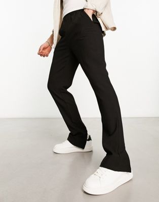 The Couture Club tailored joggers in black with zip hem
