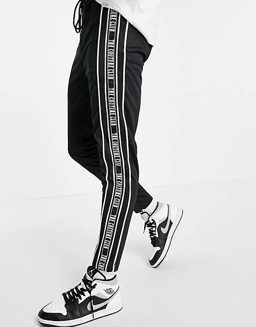 Men The Couture Club taped track joggers in black 