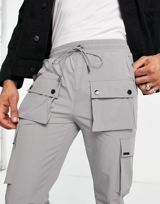 https://images.asos-media.com/products/the-couture-club-technical-cargo-pants-in-gray-with-snap-hem-detail/201876523-3?$n_550w$&wid=550&fit=constrain