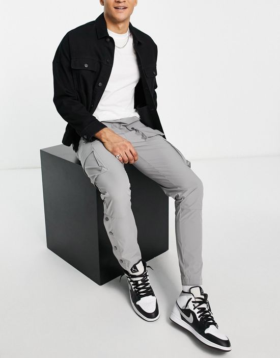 https://images.asos-media.com/products/the-couture-club-technical-cargo-pants-in-gray-with-snap-hem-detail/201876523-4?$n_550w$&wid=550&fit=constrain