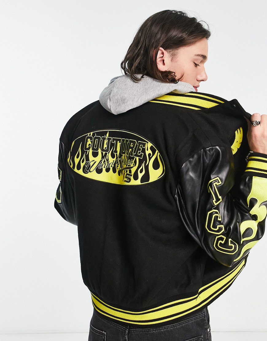The Couture Club varsity bomber jacket in black and yellow with faux leather sleeves