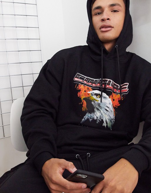 The Couture club world tour eagle print oversized hoodie in black