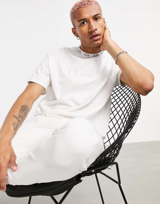 The Couture Club x ellesse – Gertrudis – T-Shirt mit Logo in Beige