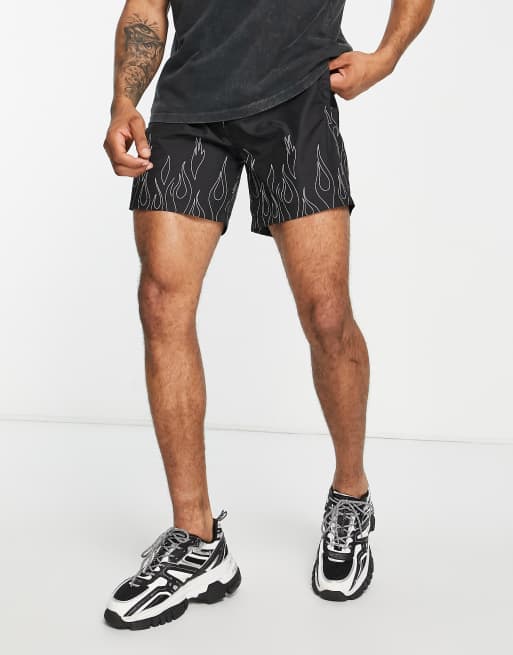 The Couture Club - Zwemshort in zwart met omlijnde vlammenprint