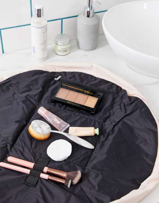 Spa composition with bath accessories in a pink string bag, flat lay. Stock  Photo by puhimec